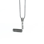 The pendant unscrewed to reveal a hidden inner compartment, emphasizing its functional design and high-tech inspiration.