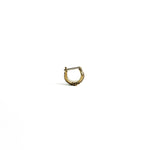 Front view of a single brass septum ring with an intricate handcrafted design, set against a white background.