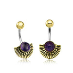 The OSIRIS Marquise Belly Piercing Ring in Gold & Amethyst from Kaya Movement features a pair of curved navel jewelry adorned with gold-colored balls at the top. Each ring showcases an intricate, fan-shaped design with a central circular amethyst gemstone, all crafted from surgical steel for an ornate and decorative look. Available in 14 gauge.