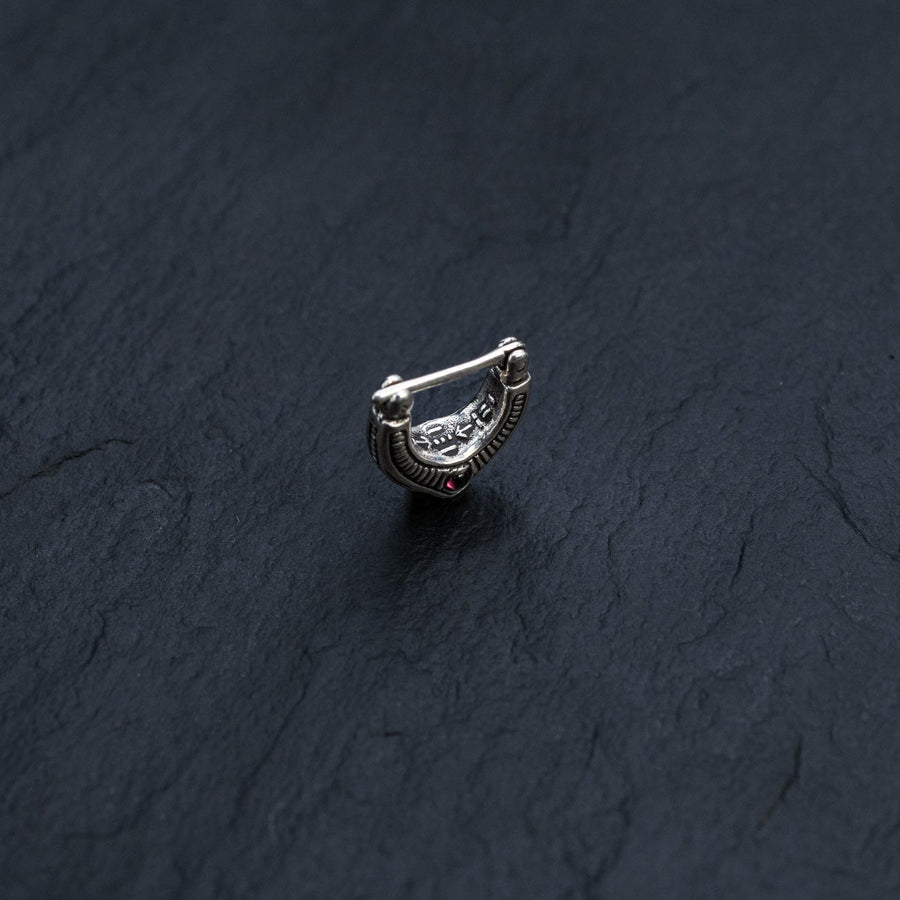 Enhance your nose piercing with the sleek and stylish design of this septum clicker, crafted for maximum impact.