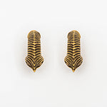Introducing the MARVDASHT Medium Cyborg Clicker Ear Weights in Gold by Kaya Movement: these meticulously crafted earrings mimic intricate, vertically aligned leaf patterns. The textured surface boasts detailed lines that lend a natural, organic feel, evoking an aesthetic reminiscent of biomechanical teardrop hoop earrings. Perfectly positioned parallel to each other against a plain white background, they are available in a 3/18" gauge.