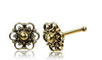 A detailed silver nose stud, each featuring a central silver ball surrounded by an ornate, circular mandala design with intricate loops and tiny bead accents from Kaya Movement. One nose stud is propped up showing the post, while the other lies flat, fully displaying the front design.