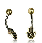 Check out the HAMSA HAND Belly Piercing Ring in Gold from Kaya Movement. This 14 gauge navel ring features a curved, surgical steel bar with a gold ball on one end and a gold Hamsa hand charm with a swirl design at the center on the other. The Hamsa hand charm elegantly hangs down, making it perfect for your navel piercing.