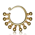 The TILA Ear Hangers in Gold by Kaya Movement are luxurious accessories crafted in a 6 gauge size, featuring an exquisite design inspired by Tribal Borneo aesthetics. Made from yellow brass, these golden ear hangers boast small spherical ornaments dangling along the bottom arc and a slight curl at the top, adding intricate detail to their elegant yet antique look.