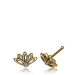 The LOTUS Flower Nose Pin Stud in Gold by Kaya Movement is displayed, showcasing a stylized lotus flower design with a slightly antiqued finish that delivers a delicate and elegant look. Reminiscent of minimalist body jewelry, one nose pin is positioned with the post up, while the other lies flat to display the front.