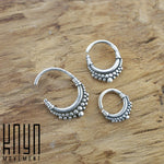 Three BIASA Seamless Rings in Silver (16 gauge) from Kaya Movement, featuring intricate dot detailing and a boho beaded design, are displayed on a wooden surface. The Kaya Movement logo is visible in the bottom left corner of the image.