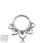 Introducing the MAWAR Lotus Flower Septum Ring in Silver | 18 gauge by Kaya Movement. This stunning piece features a floral design with five petal-shaped extensions, each adorned with a cluster of three small beads. The left side of the ring is open for easy insertion, and it is expertly crafted from 925 silver body jewelry. The bottom left corner of the image proudly displays the "Kaya Movement" logo.