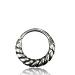 A close-up of the TIARA Seamless Nose Ring in Silver from Kaya Movement against a white background. The 18 gauge body jewelry features a twisted, rope-like design on the lower half and has an open clasp on the top, perfect for multi-use piercing.