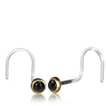 The EDEN Nose Screw Stud in Gold or Silver with Onyx, created by Kaya Movement, features a minimalist and elegant design. The 20-gauge body jewelry showcases round black onyx stones set in gold-tone bezels at the ends, with clear hooks that offer a striking contrast to the setting.