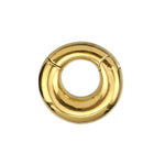 The Minimalist Steel Hoop Ear Weights in Gold by Kaya Movement feature a shiny, gold circular clasp with a smooth, curved finish. The 2-gauge clasp has a small hinge and magnet closure, indicating it can be easily opened and closed. Its minimalist design is simple and elegant.