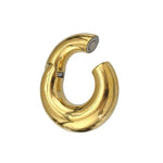 Introducing the Minimalist Steel Hoop Ear Weights in Gold with Magnet Closure from Kaya Movement. These chunky, tubular earrings showcase a smooth, reflective surface and an open-end design, creating a bold and modern look reminiscent of minimalist ear weights.