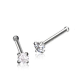 Two Tiny Diamond Silver Nose Pin Studs by Kaya Movement are displayed against a white background. Each stud features a small, round zircon crystal set in a prong setting on a straight surgical steel 316L post. One stud is upright while the other is slightly tilted to the right.
