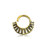 Introducing the Gold-Plated Brass Septum in Maya Tribal Design by Kaya Movement, a unique and trendy jewelry piece. Featuring a yellow-gold-colored circular shape with vertical cut-out sections along the bottom half, this nose ring echoes Maya cultural motifs. The open-top design creates a slightly horseshoe-like appearance, with its reflection visible at the base. Ideal for various piercings such as nose, helix 1.2mm, tragus, lobe, and conch.
