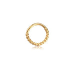 A Lysa Elegant Design Septum by Kaya Movement, featuring gold beads on a seamless circular frame, is displayed against a plain white background. The tiny beads are evenly spaced along the lower half of the stainless steel 316L jewelry, providing a textured appearance.