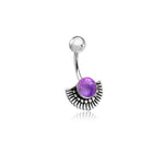 The Kaya Movement's Nala Navel Jewelry showcases an Inca-inspired half-moon design with a vibrant central purple amethyst, all crafted from 316L surgical steel. This exquisite boho ethnic piece features a small, plain silver ball at the top end, accentuating its unique and intricate pattern.