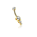 Introducing the Kaya Movement's Xane 1.6mm Navel Piercing with a brilliant gold finish, crafted from surgical steel and adorned with four sparkling zircons. This elegant belly button ring features a smaller zircon at one end and a larger zircon at the other, complemented by three additional varying-sized zircons arranged vertically beneath the larger gem. Perfect for adding a touch of luxury to any navel piercing.