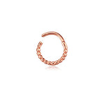 The Liora Elegant Septum by Kaya Movement features a stunning rose gold-tone design with a beaded detail on half of the circular ring, while the other half remains a smooth, unadorned metal arc. Photographed against a white background, this stainless steel 316L jewelry piece adds subtle shine and everyday elegance whether worn in the nose, tragus, or lobe. The septum measures 1.2mm thick and 8mm in diameter.