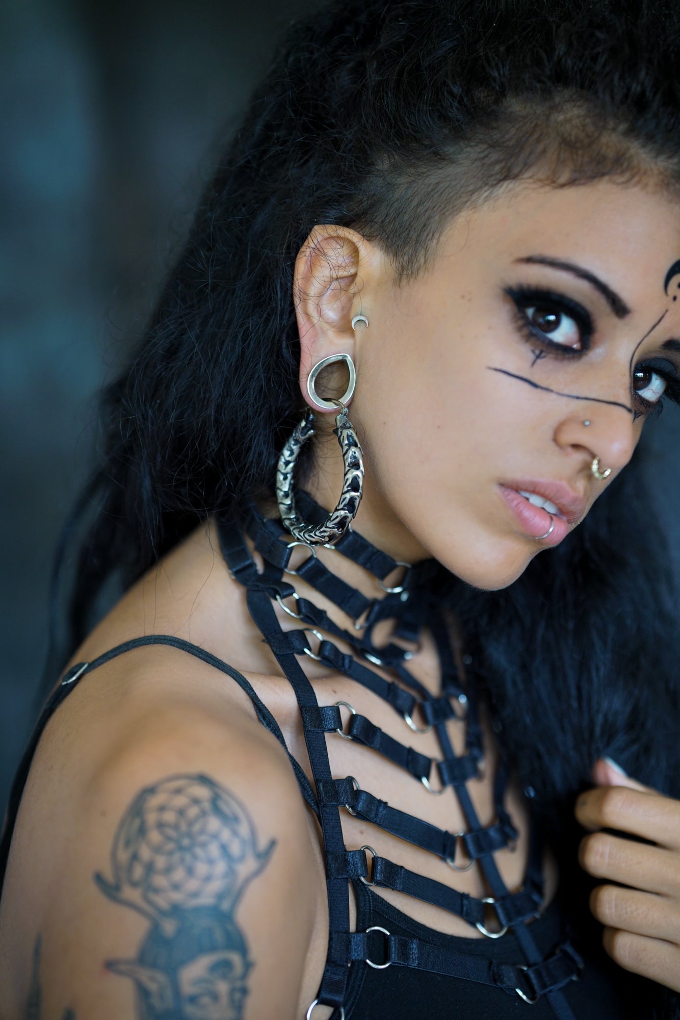 Large disc earring tribal-goth ink girl