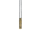 A brass Arcan Box pendant, hanging against a white background, displaying its bold and futuristic structure.