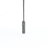 A minimalist futuristic pendant in dark metallic finish, suspended from a black cord. The sleek, geometric design gives it an industrial cyberpunk aesthetic.