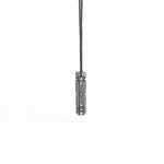 A minimalist futuristic pendant in dark metallic finish, suspended from a black cord. The sleek, geometric design gives it an industrial cyberpunk aesthetic.