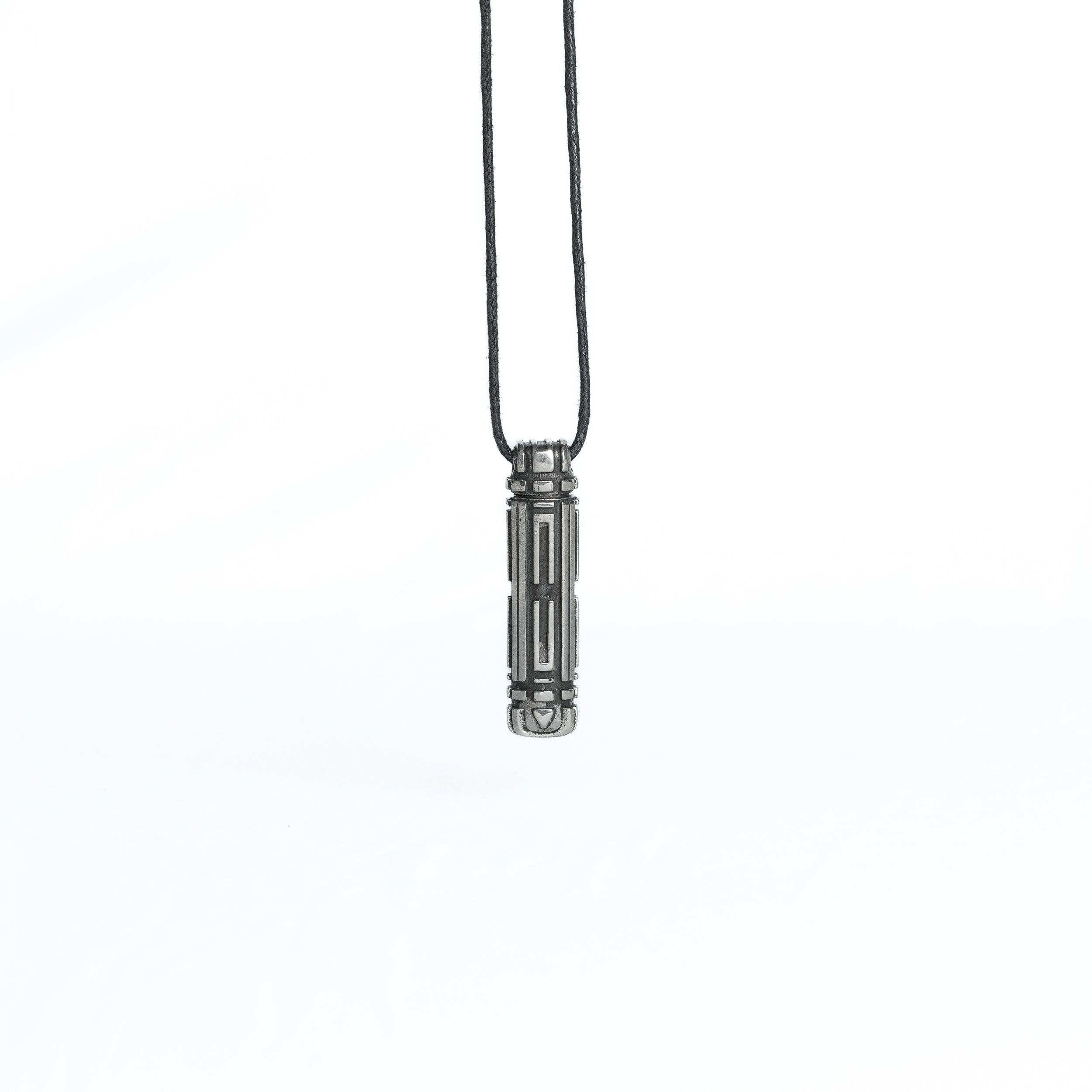 A straight-on view of the pendant hanging from its cord, highlighting the symmetry and mechanical precision of the design.