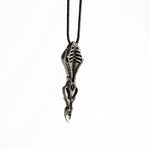 Close-up of the Silver 925 spoon pendant, highlighting its biomechanical details and the smooth, polished finish.