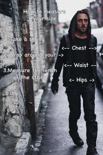A person in dark clothing, sporting the VENOM Men's Leather Hooded Vest Jacket with red lining from Kaya Movement, walks through an alley with graffiti-covered walls. Superimposed text explains measuring sizes: "1. Take a string, 2. Wrap around your chest, waist, hips, 3. Measure the length of the string" with arrows pointing to each area.