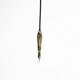 Side view of the brass spoon pendant, displaying the detailed craftsmanship and dark oxidized finish.