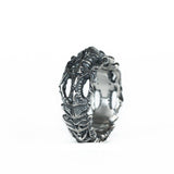 Upright BIOORGA silver ring showing its ribbed central design.
