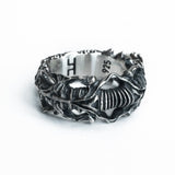 Top angled view of the BIOORGA sterling silver ring, showing its sculpted band and hallmarks.