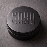 Reusable black Kaya Movement metal ring box.