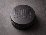 Reusable black Kaya Movement metal ring box.