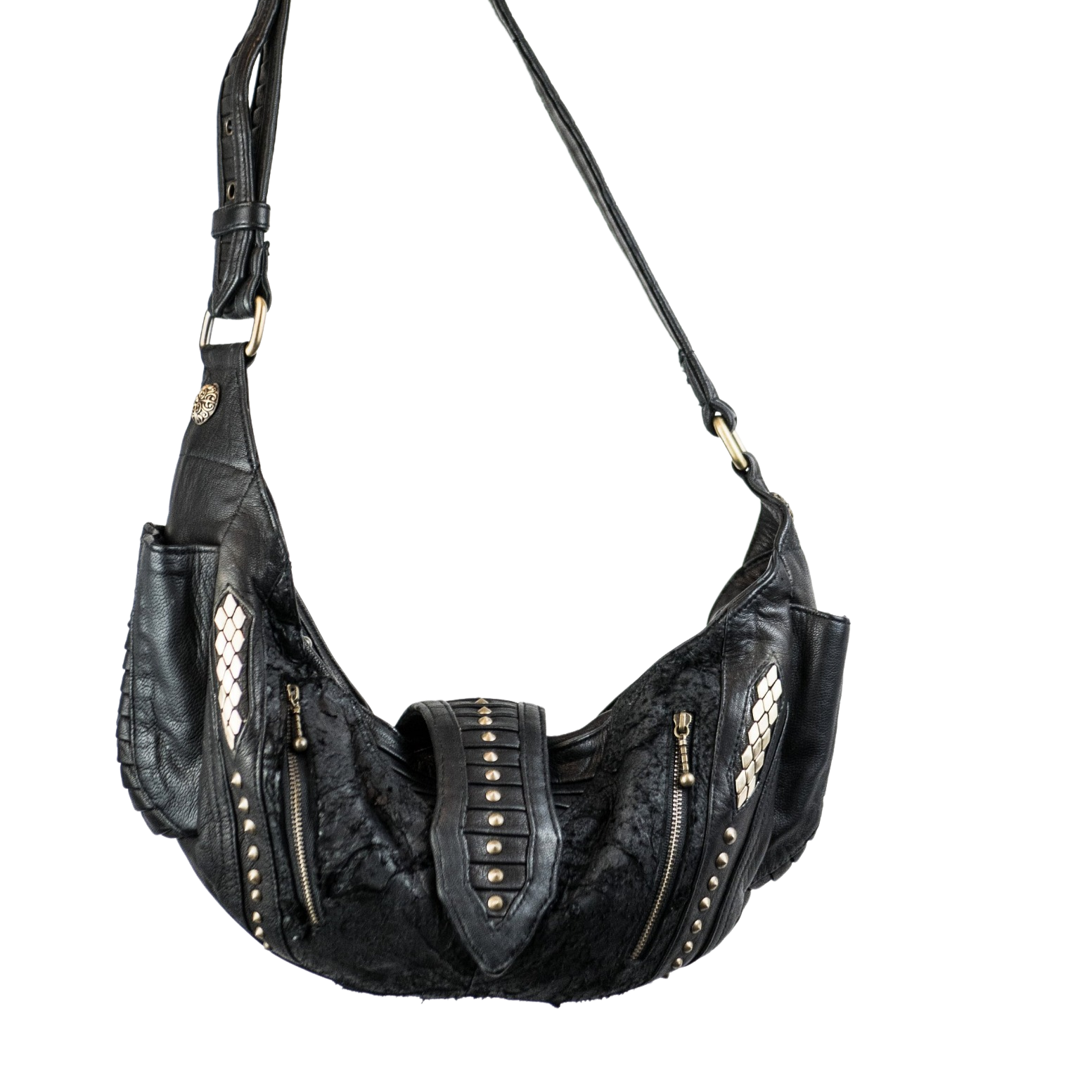 The Kaya Movement's Nebula Unisex Leather Off Shoulder Cross Body HandBag is perfect for dystopian festivals. This bag, featuring a black leather finish with a shoulder strap and silver stud accents, is designed with two front zippered pockets and decorative stitching along the sides. The textured surface combines smooth and patterned leather sections, highlighting the artistry of custom leather goods craftsmanship.