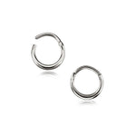 Introducing the AMAO Clicker Nose Ring in 316L Steel by Kaya Movement. Crafted from premium minimal 316L surgical steel with a polished finish, this stylish accessory features a simple, sleek design and a hinge and clasp closure mechanism. Versatile enough to double as multi-use body jewelry, it is showcased on a plain white background with an elegant reflection effect beneath it.
