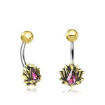 A pair of LIOSA Marquise Belly Piercing Rings in Gold & Purple Crystal by Kaya Movement, crafted from surgical steel. Each features a gold lotus flower at one end, with a purple teardrop-shaped gem in the center, and a rounded gold ball at the other end. This exquisite navel jewelry adds a touch of elegance to any look.