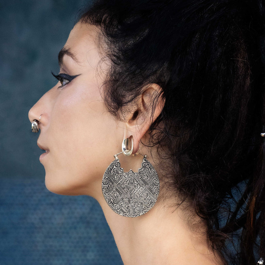 Shipibo silver disc earring