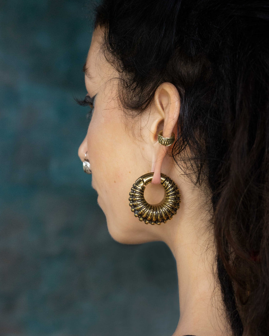 Trilobita ear weights in gold