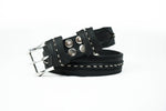 The ITO Punk Rock Men's Black Studded Leather Belt by Kaya Movement, featuring a custom wasteland buckle, adorned with multiple silver spikes along its length and white stitching along the edges, coiled neatly on a white background.