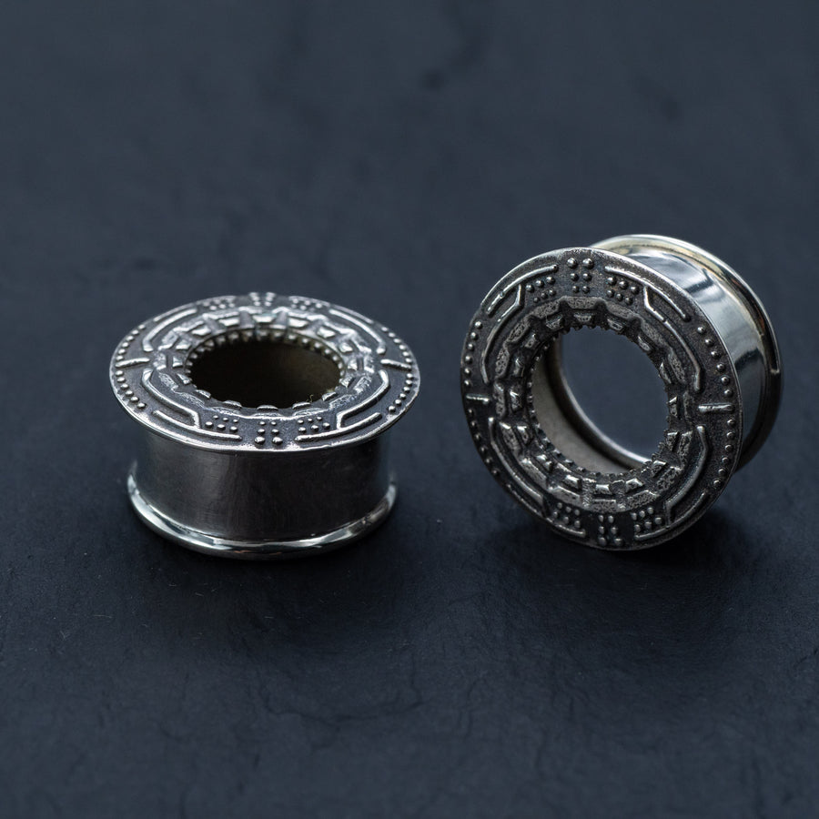 Close-up of the Sci-Fi Silver Tunnel, featuring intricate design and smooth finish. Ideal for festival body jewelry. Available in sizes 8mm to 30mm.