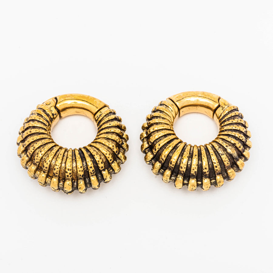 Trilobita ear weights in gold