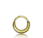 The AMA Seamless Nose Ring in Gold (9mm) by Kaya Movement is displayed against a plain white background. This small, minimalist body jewelry features an open-ended design, forming nearly a full circle with a slight gap—perfect for those seeking understated elegance.