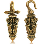 The Kaya Movement's Ear Weights Blind Justice and Brass Ear Weights Justice are two intricately designed golden pendants featuring ornate floral motifs and exquisite detailing. One pendant showcases a pointed base, while the other features a hook-like top. Both pieces exude an antique craftsmanship reminiscent of tribal ear hangers in brass jewelry.