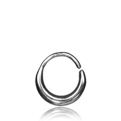 The AMA Seamless Nose Ring in Silver by Kaya Movement is a sleek, sterling 925 silver band designed as an open circle or hoop. This 18-gauge ring features a polished, smooth surface with one end slightly overlapping the other, leaving a small gap for adjustable fitting. The image is set against a clean white background, accentuating the ring's reflective quality.
