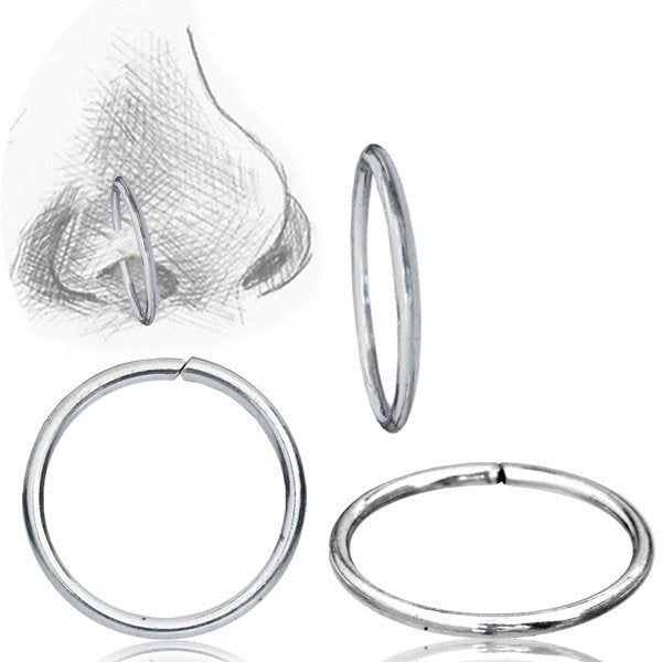 Illustration of a nose piercing featuring the INDUS Seamless Minimalist Hoop Ring in Silver by Kaya Movement, alongside three different views of the same 20 gauge 925 silver body jewelry. The image displays the minimalistic design from the front, side, and an angled perspective, highlighting its seamless, circular charm.