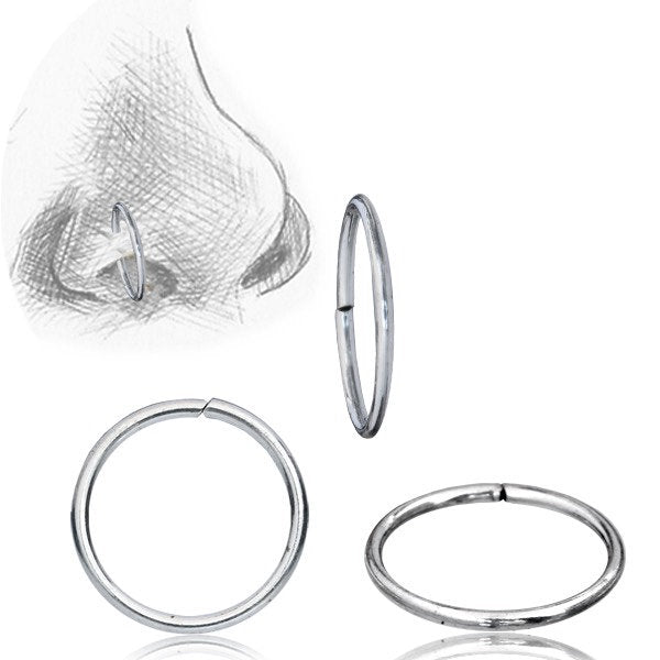 This collection features the INDUS Seamless Minimalist Hoop Ring in Silver (20 gauge) by Kaya Movement. The upper left illustration depicts a nose adorned with one of these minimalist rings inserted, while the other rings are showcased against a white background, highlighting their circular shape and metallic sheen.