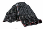 The DZALA Black Genuine Leather Fingerless Gloves from Kaya Movement boast a rugged design and feature reinforced knuckles adorned with decorative metal studs. With striking red accents against the black leather, these custom motorcycle gloves are laid out overlapping on a white surface, exuding both style and durability.