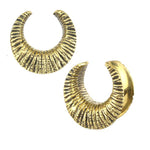 Introducing the Reptilian Skin Horseshoe Saddle Tunnels in Gold by Kaya Movement, available in gauges from 12mm to 18mm. These stunning golden tunnels feature a textured, ribbed design that evokes the look of reptile skin. Their slightly open-ended crescent form creates a modern, elegant appearance, while the intricate ridges provide both tactile and visual appeal.