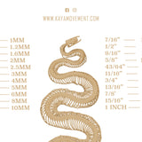 Image of a flyer from Kaya Movement showcasing a stylized snake skeleton design. It lists various piercing gauge sizes and their corresponding measurements in millimeters, ranging from 18G (1.1MM) to 1 INCH (25MM). Discover their handcrafted tribal plugs like the TIMO Sacred Lotus Mandala Round Tunnels in Silver, available in gauges from 3mm to 18mm, and more at www.kayamovement.com.