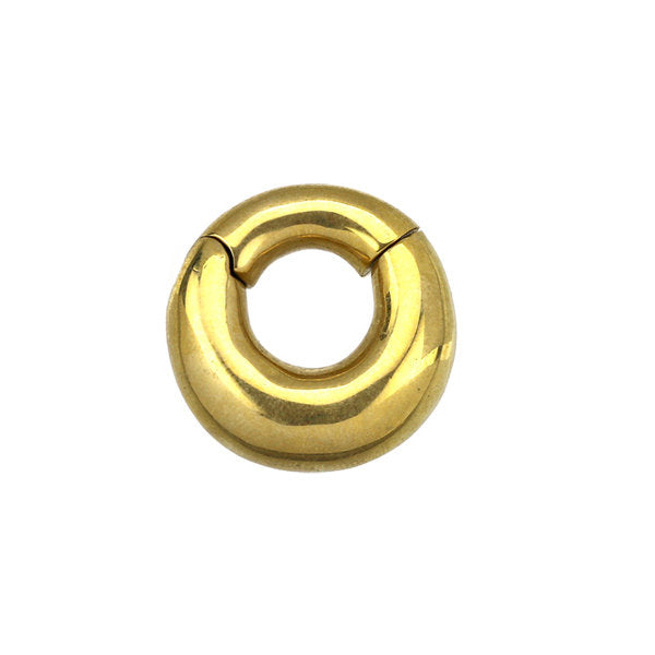 A round, shiny gold-colored metal clasp with a smooth finish and a small opening at the top, perfect for attaching to unisex body jewelry such as the DAYA Minimalist Hoop Ear Weights in Gold with Clicker by Kaya Movement.